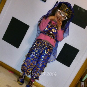 Molly wearing Turkish belly dancing outfit and cat-eye glasses as a Katy Perry Halloween costume.